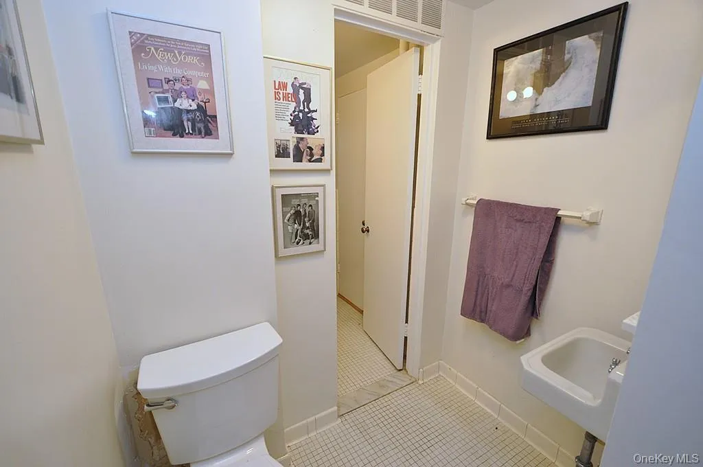 Half bath has access from both the hall and primary bedroom via the full bath. view 1 Half bath has access from both the hall and primary bedroom via the full bath. view 1