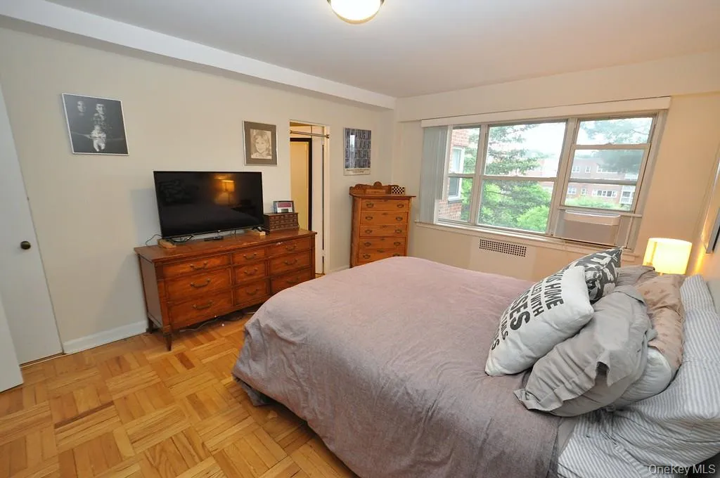 The primary bedroom has parquet floors, two large closets and access to the full bath. The bedroom is approx 16'-6" x 11'-8" The primary bedroom has parquet floors, two large closets and access to the full bath. The bedroom is approx 16'-6" x 11'-8"