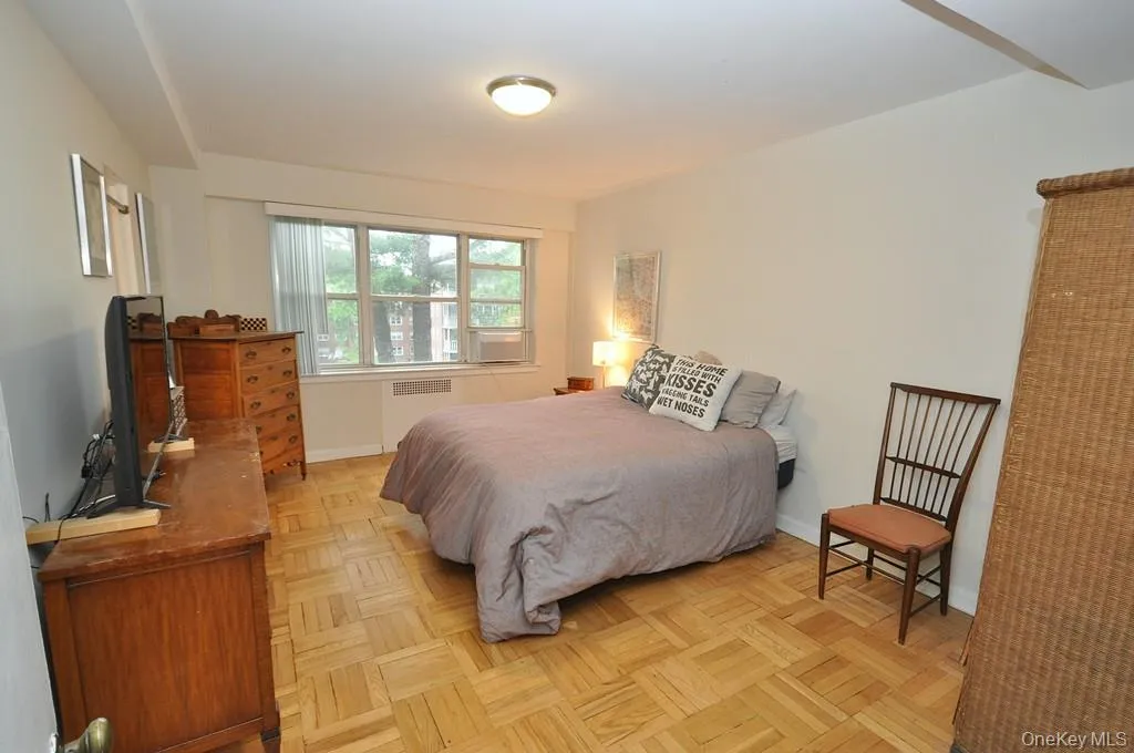 The primary bedroom has parquet floors, two large closets and access to the full bath. The bedroom is approx 16'-6" x 11'-8" The primary bedroom has parquet floors, two large closets and access to the full bath. The bedroom is approx 16'-6" x 11'-8"