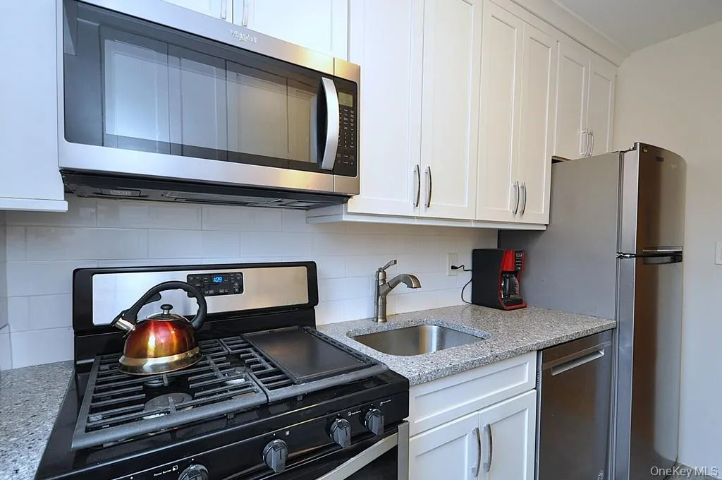 New Kitchen with Granite Counters, Stainless Steel Appliances including a dishwasher, microwave, rang and refrigerator. New Kitchen with Granite Counters, Stainless Steel Appliances including a dishwasher, microwave, rang and refrigerator.