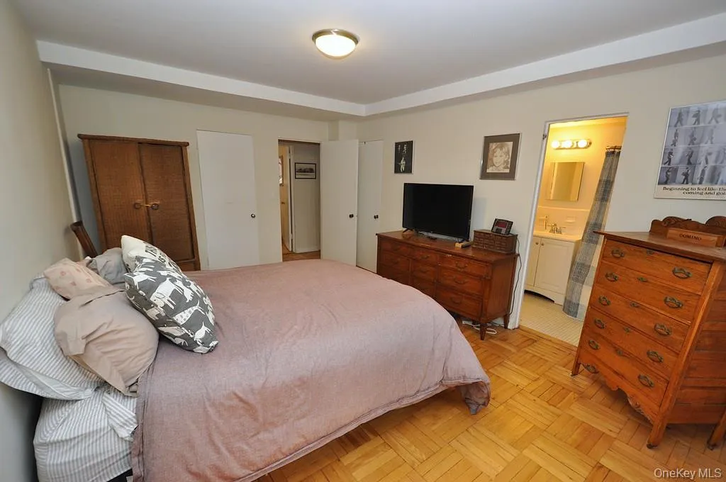 The primary bedroom has parquet floors, two large closets and access to the full bath. The bedroom is approx 16'-6" x 11'-8" The primary bedroom has parquet floors, two large closets and access to the full bath. The bedroom is approx 16'-6" x 11'-8"