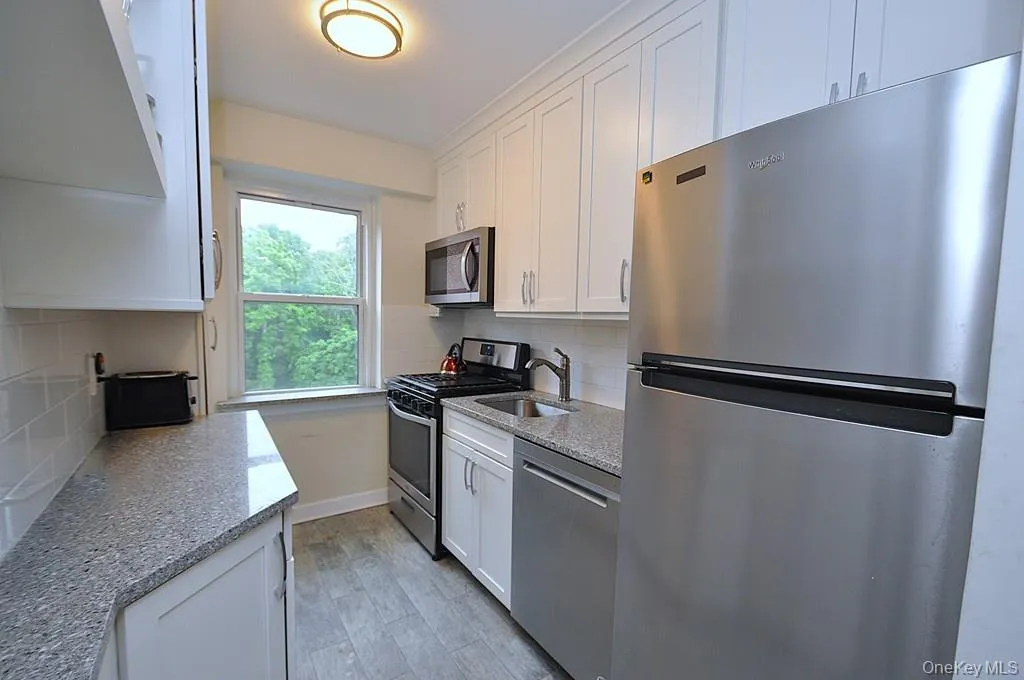 New Kitchen with Granite Counters, Stainless Steel Appliances including a dishwasher, microwave, rang and refrigerator. New Kitchen with Granite Counters, Stainless Steel Appliances including a dishwasher, microwave, rang and refrigerator.