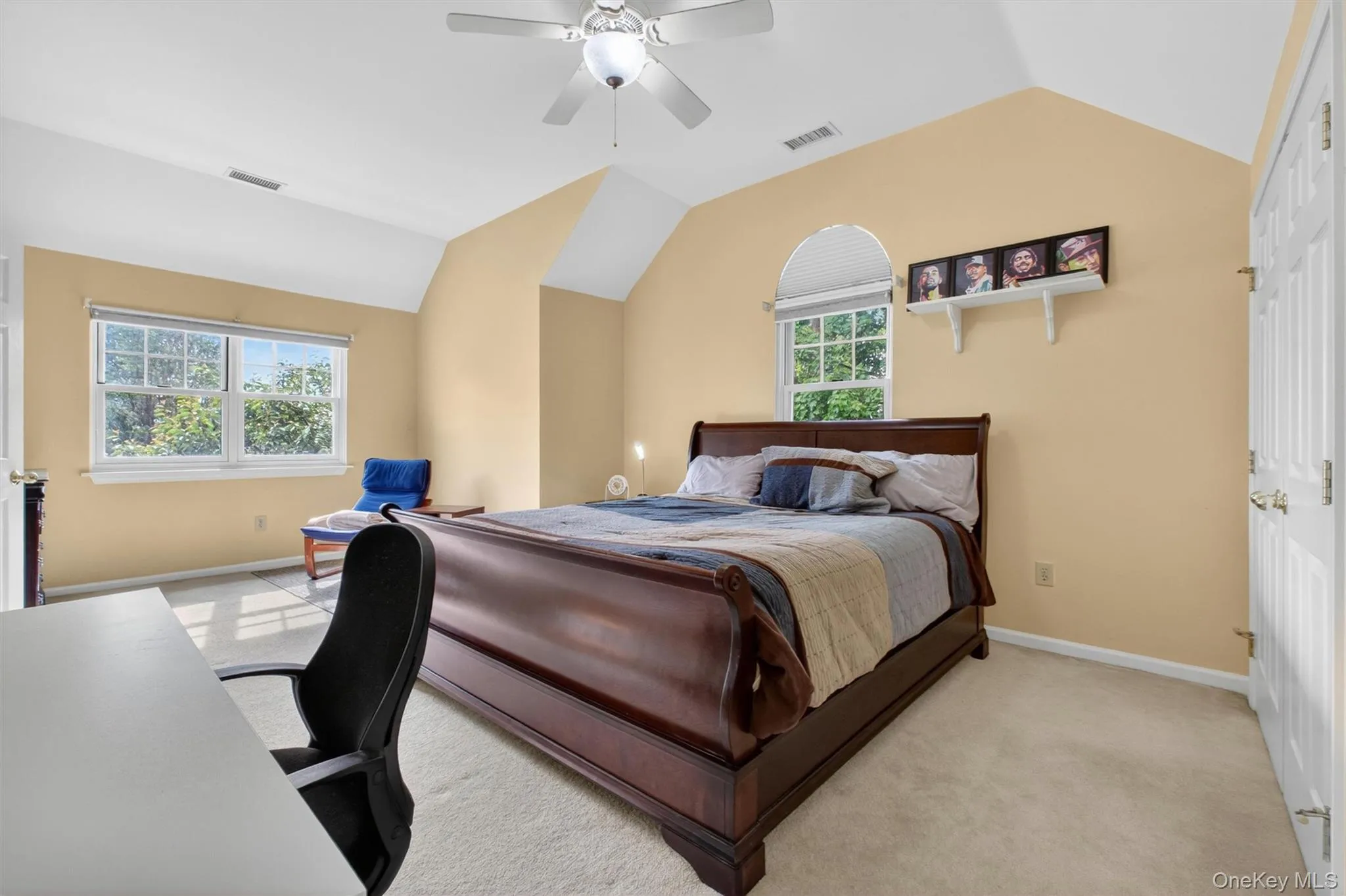 Large additional bedroom with vaulted ceiling and abundant natural light Large additional bedroom with vaulted ceiling and abundant natural light