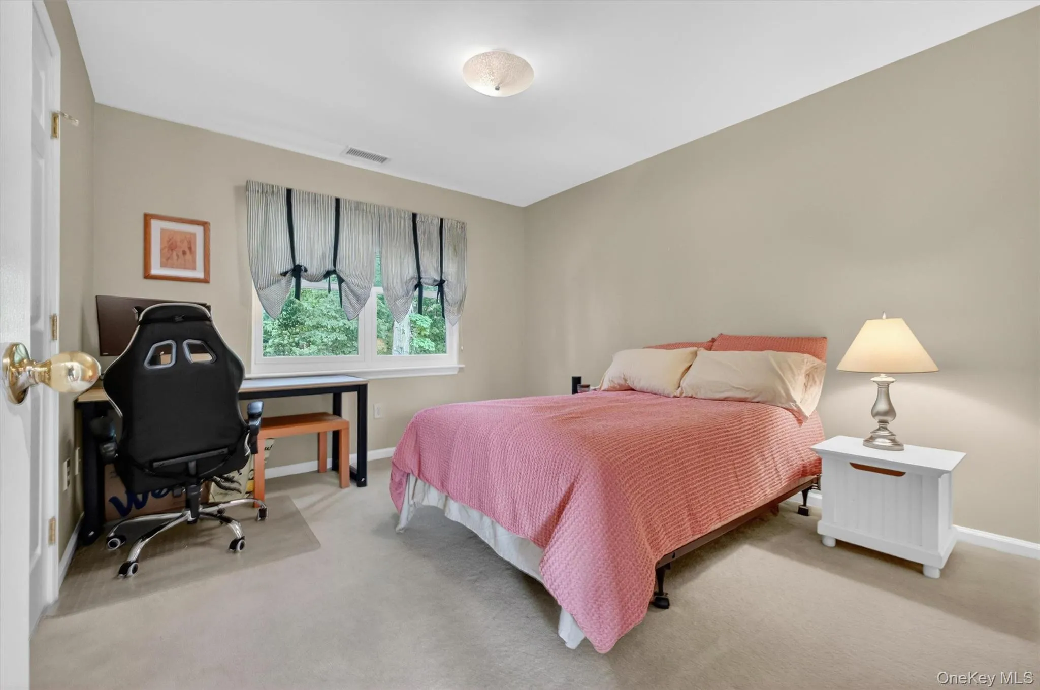 Spacious secondary bedroom with neutral tones and large windows. Spacious secondary bedroom with neutral tones and large windows.