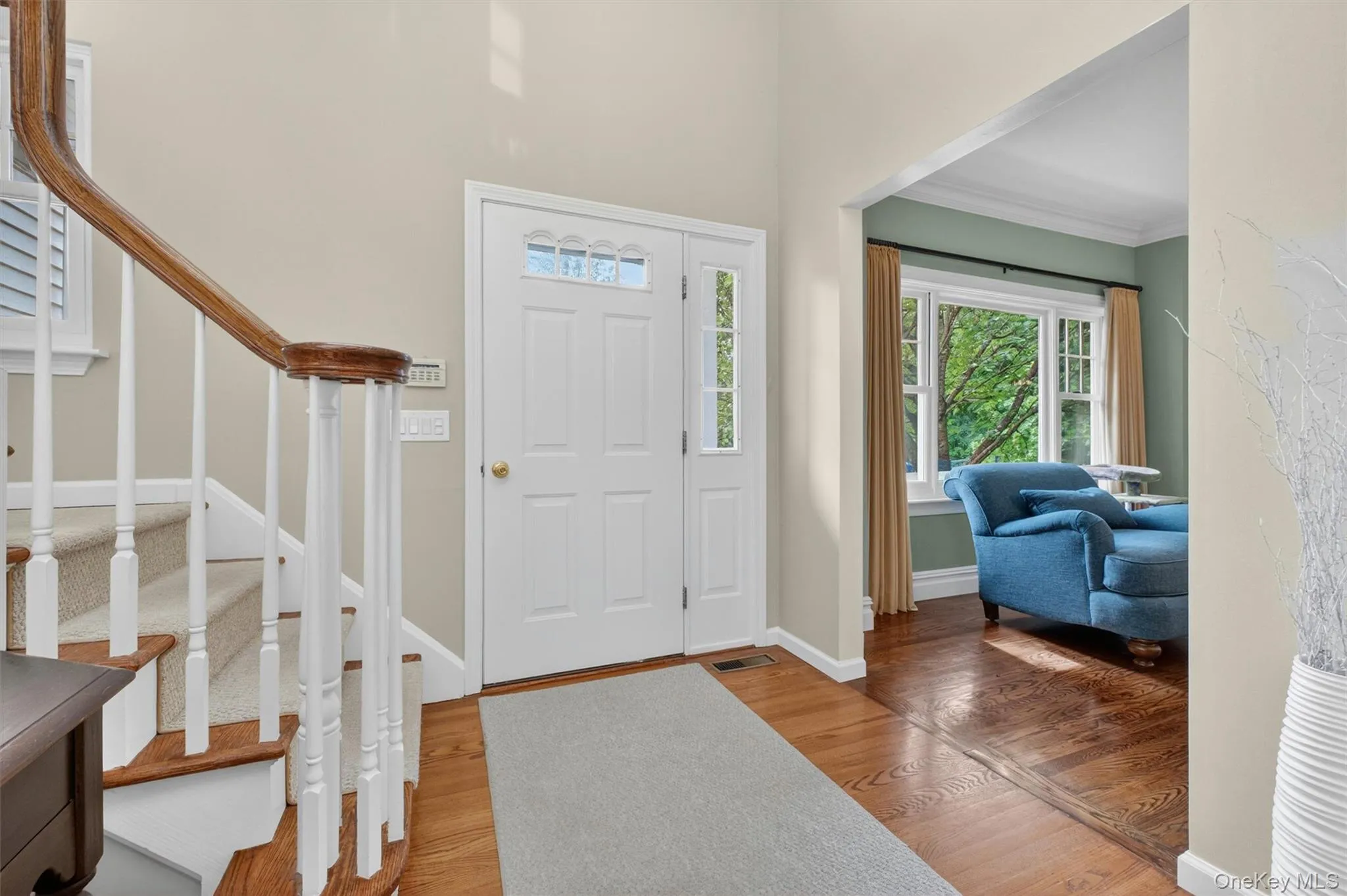 Sun-filled foyer with soaring ceilings and open flow to the main living spaces. Sun-filled foyer with soaring ceilings and open flow to the main living spaces.
