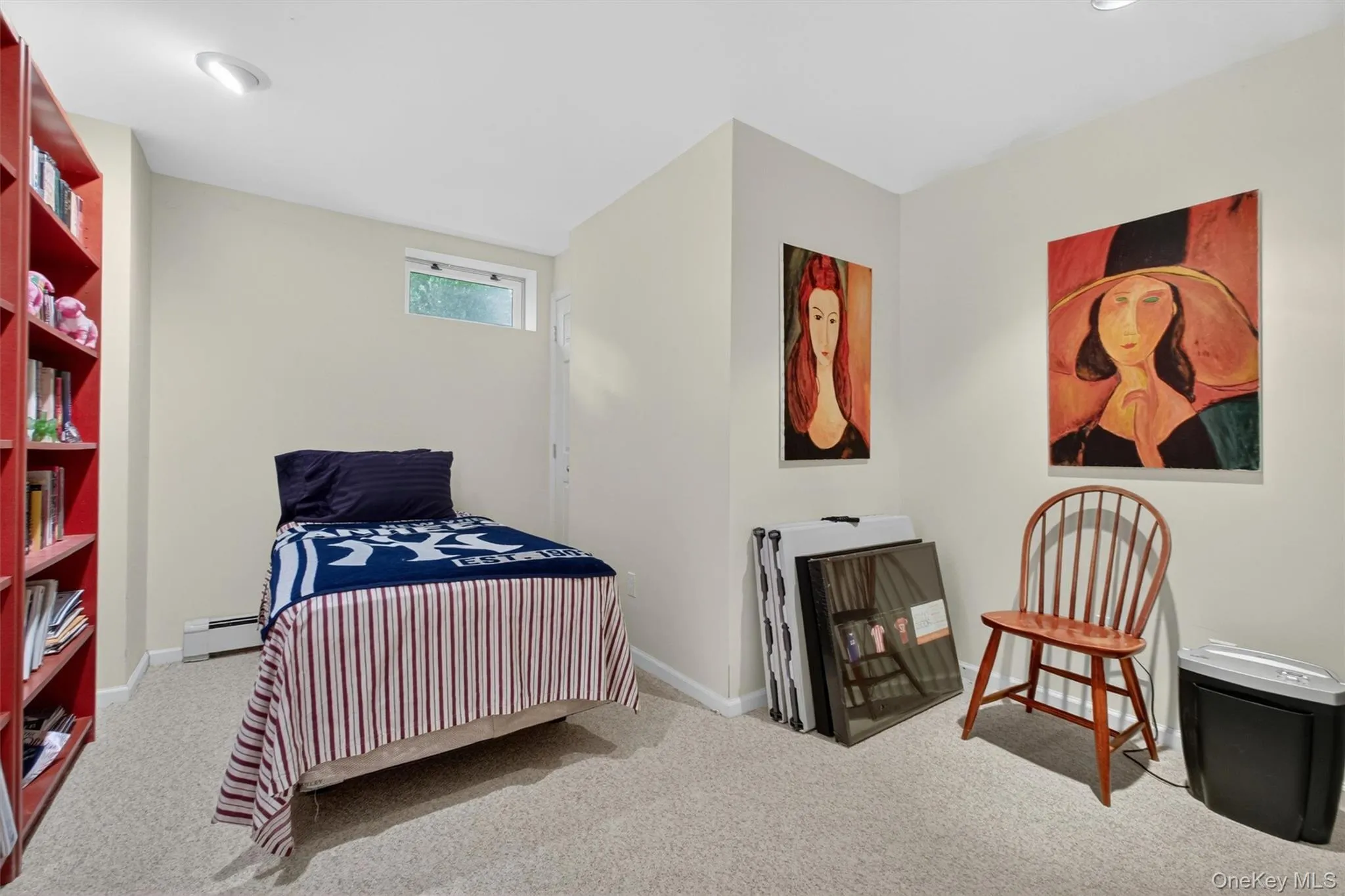 Flexible lower level room perfect for a home office, guest room, or creative studio. Flexible lower level room perfect for a home office, guest room, or creative studio.