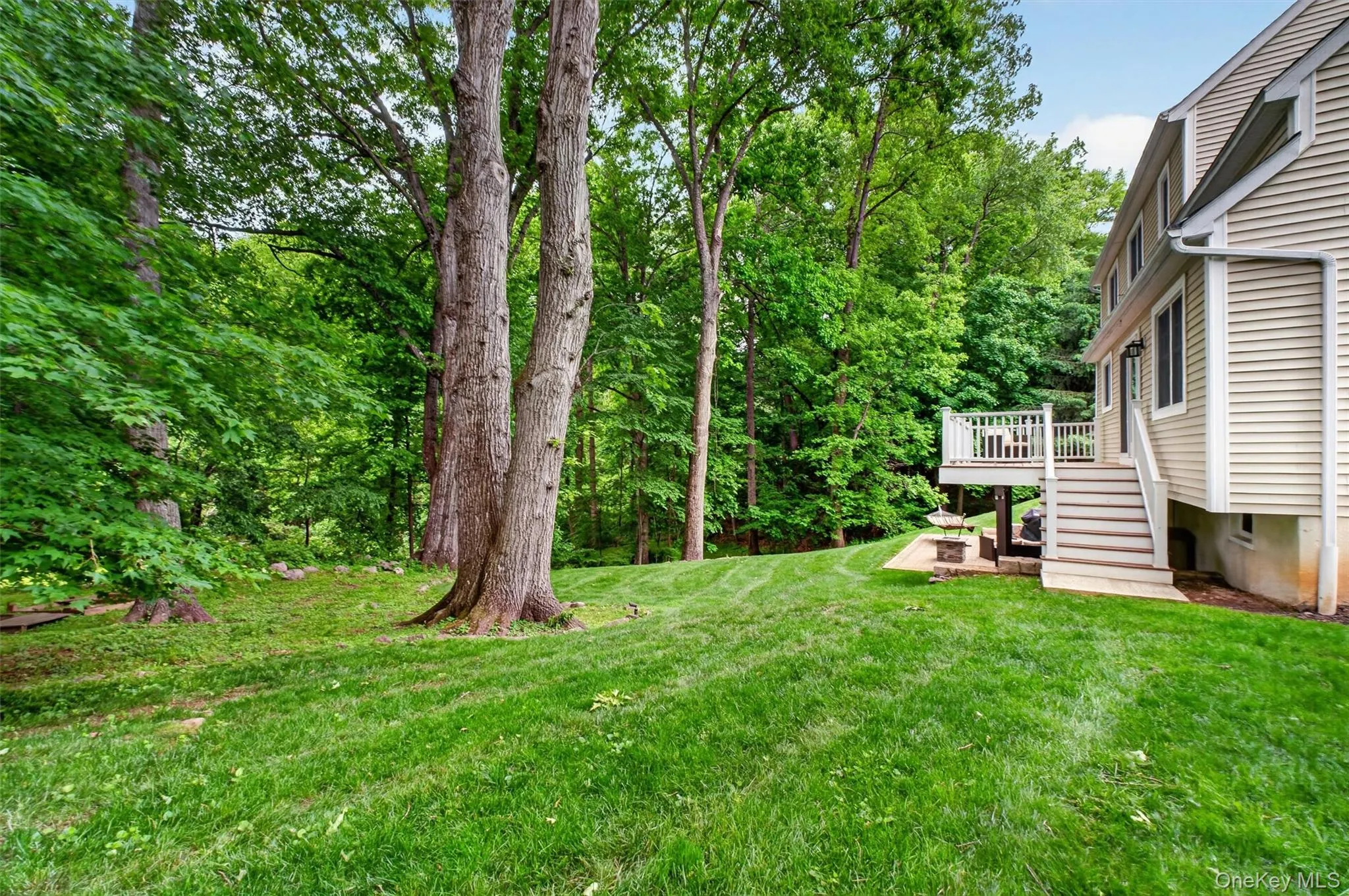 Beautiful backyard with mature trees and plenty of open lawn space. Beautiful backyard with mature trees and plenty of open lawn space.