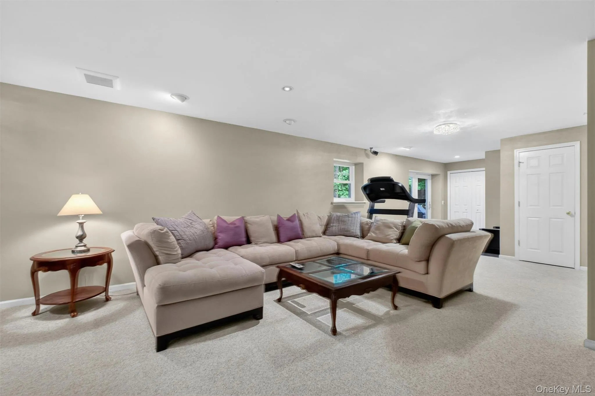 Spacious lower level recreation room with walk-out access and plenty of room to relax or entertain. Spacious lower level recreation room with walk-out access and plenty of room to relax or entertain.