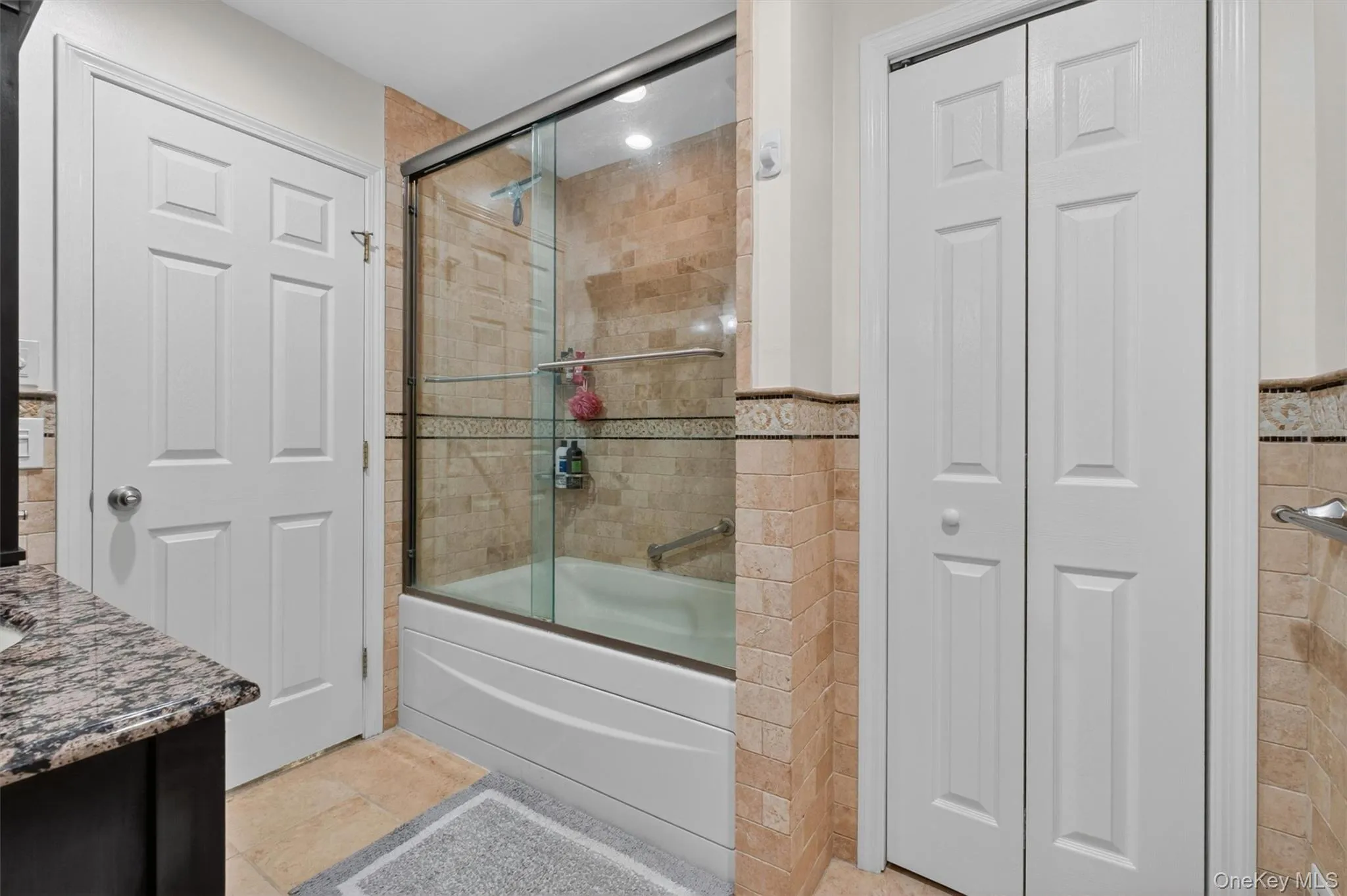 Primary bath with soaking tub/shower combination and ample storage. Primary bath with soaking tub/shower combination and ample storage.