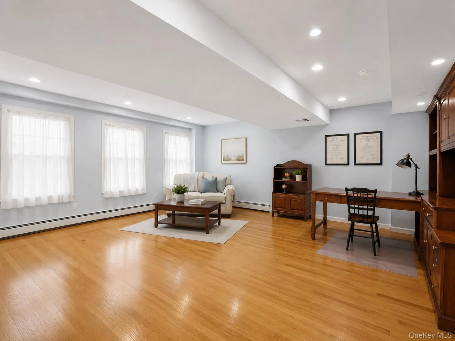 Substantial home office or exercise room with light wood-finish flooring (split level down from main) Substantial home office or exercise room with light wood-finish flooring (split level down from main)