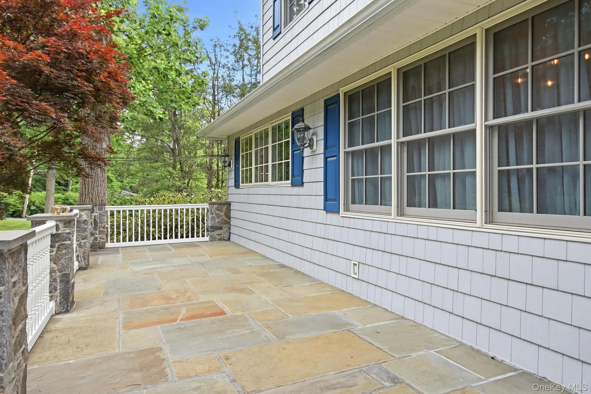 Inviting front porch, perfect for morning coffee and peaceful views Inviting front porch, perfect for morning coffee and peaceful views