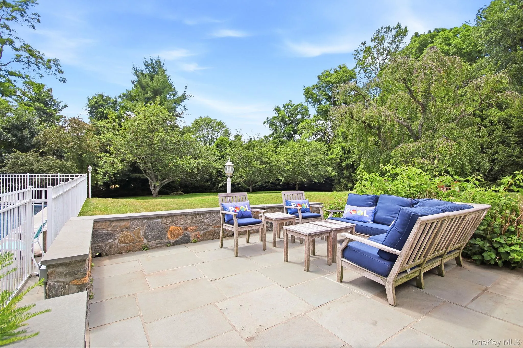 Expansive patio with a stone retaining wall Expansive patio with a stone retaining wall