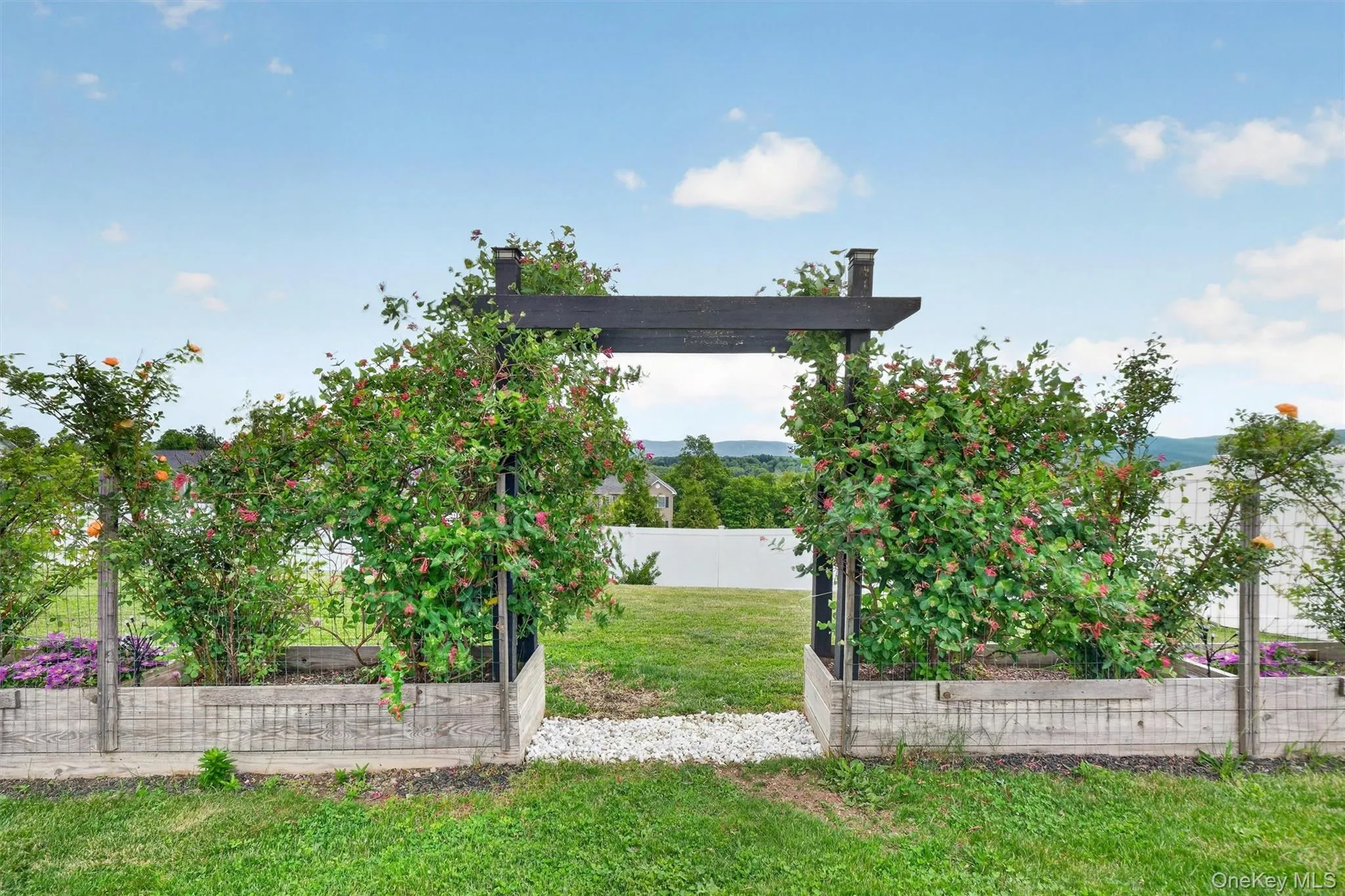 Garden with Perennials, Pergola, and Raised Beds Garden with Perennials, Pergola, and Raised Beds