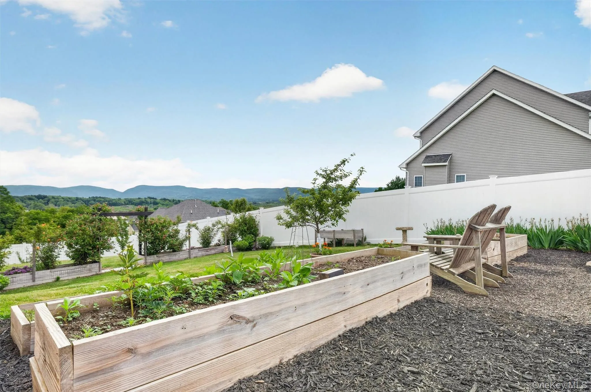 Garden with Perennials, Pergola, and Raised Beds Garden with Perennials, Pergola, and Raised Beds