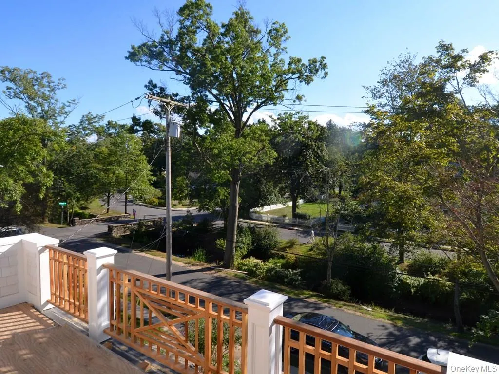 View from the primary bedroom deck overlooking The Brook in Larchmont Gardens View from the primary bedroom deck overlooking The Brook in Larchmont Gardens