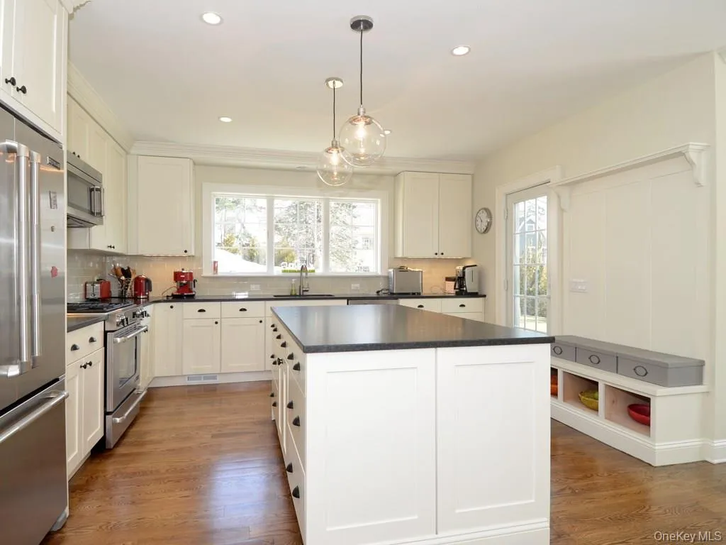 Chef's kitchen with a large center island. Chef's kitchen with a large center island.