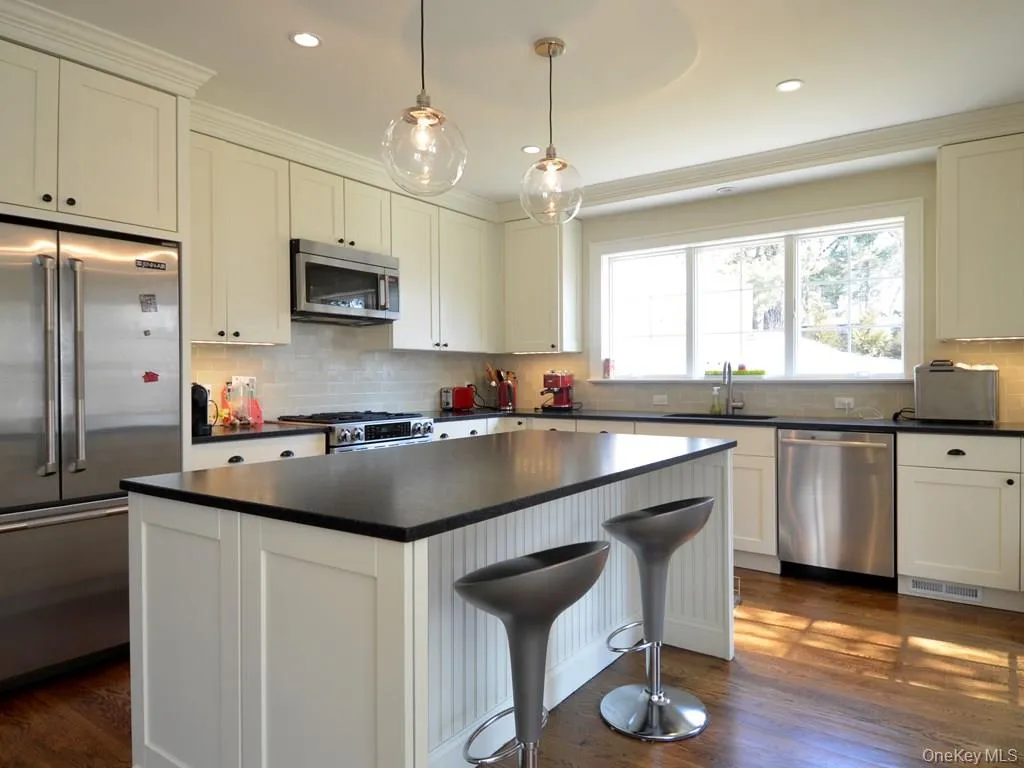 Custom crafted cabinetry, hardwood floors and "leathered" granite counter tops. Custom crafted cabinetry, hardwood floors and "leathered" granite counter tops.