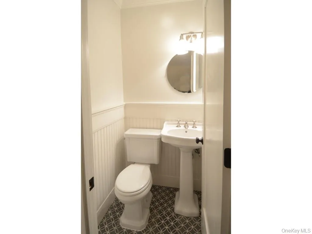 First floor powder room with Waterworks fixtures and tile. Located just of the MEIK. First floor powder room with Waterworks fixtures and tile. Located just of the MEIK.