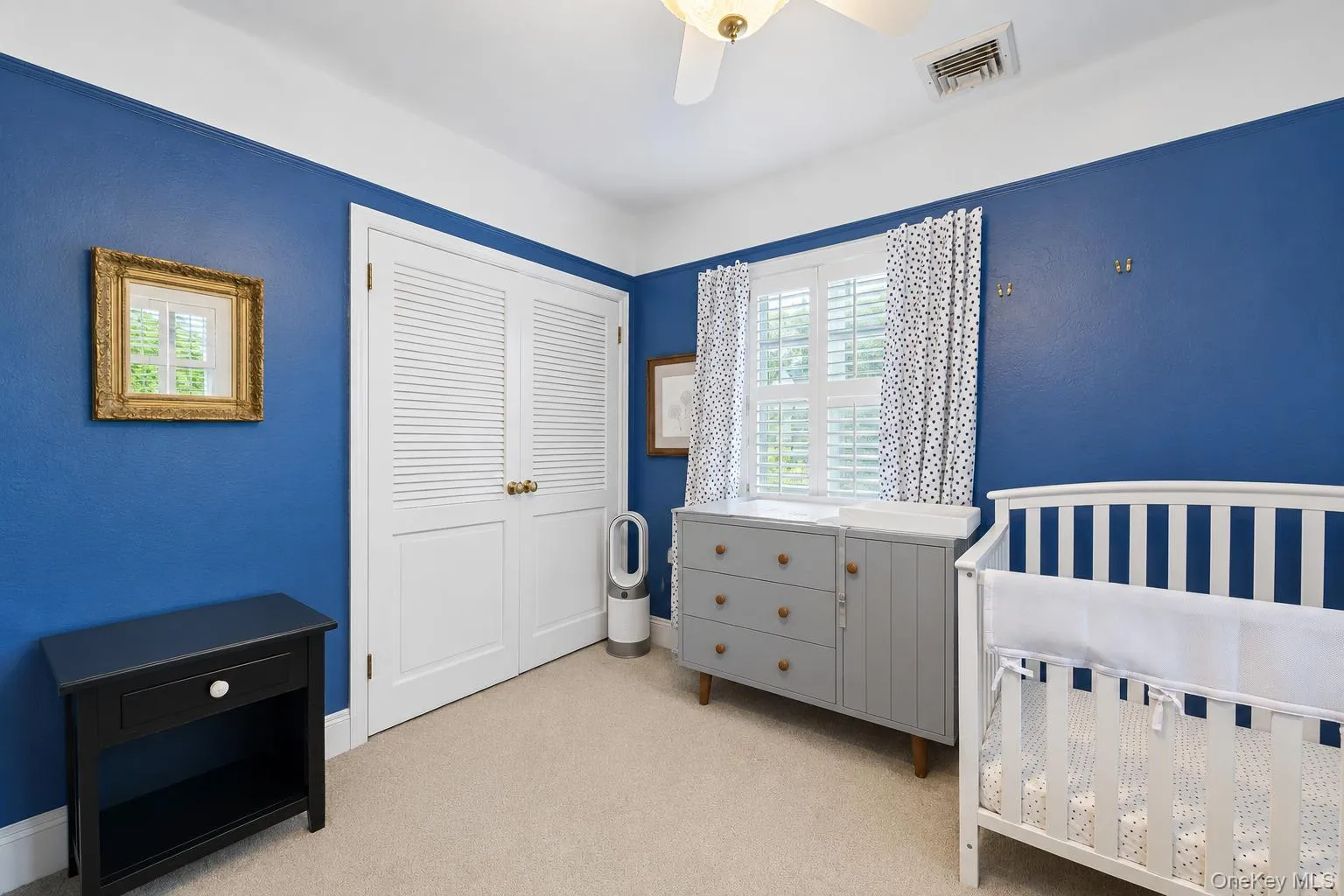 Bedroom featuring carpet flooring and white crown molding Bedroom featuring carpet flooring and white crown molding