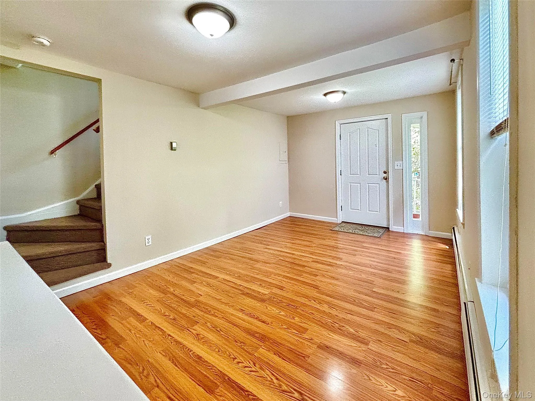 Wood floor. Stairs to bedrooms and bath. Wood floor. Stairs to bedrooms and bath.