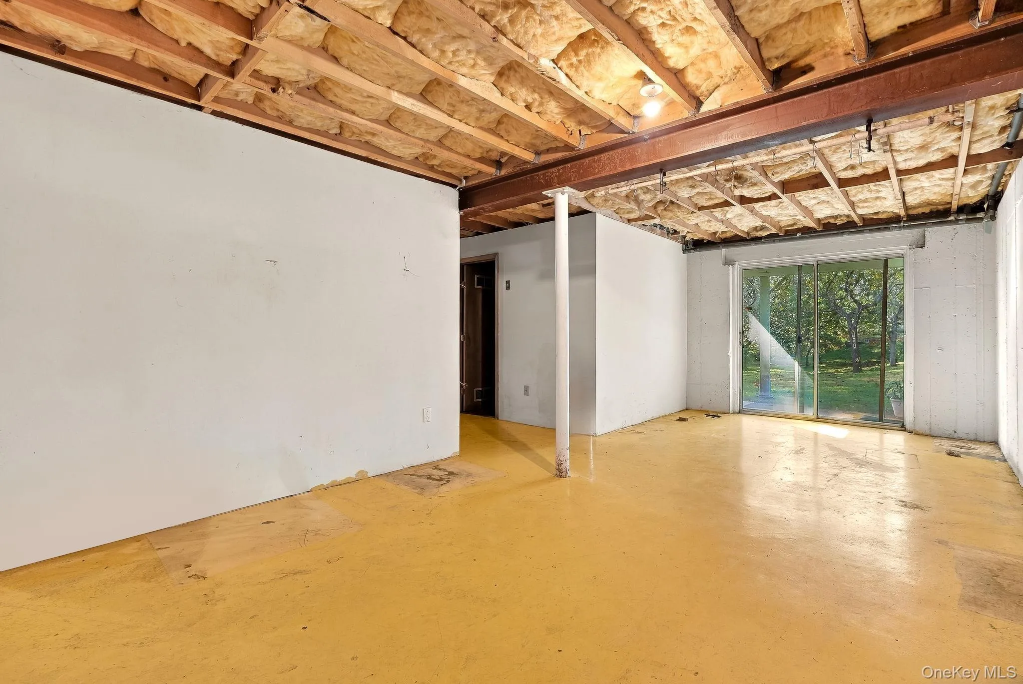 Sliders to the back yard - and your laundry/boiler room complete the space. Sliders to the back yard - and your laundry/boiler room complete the space.