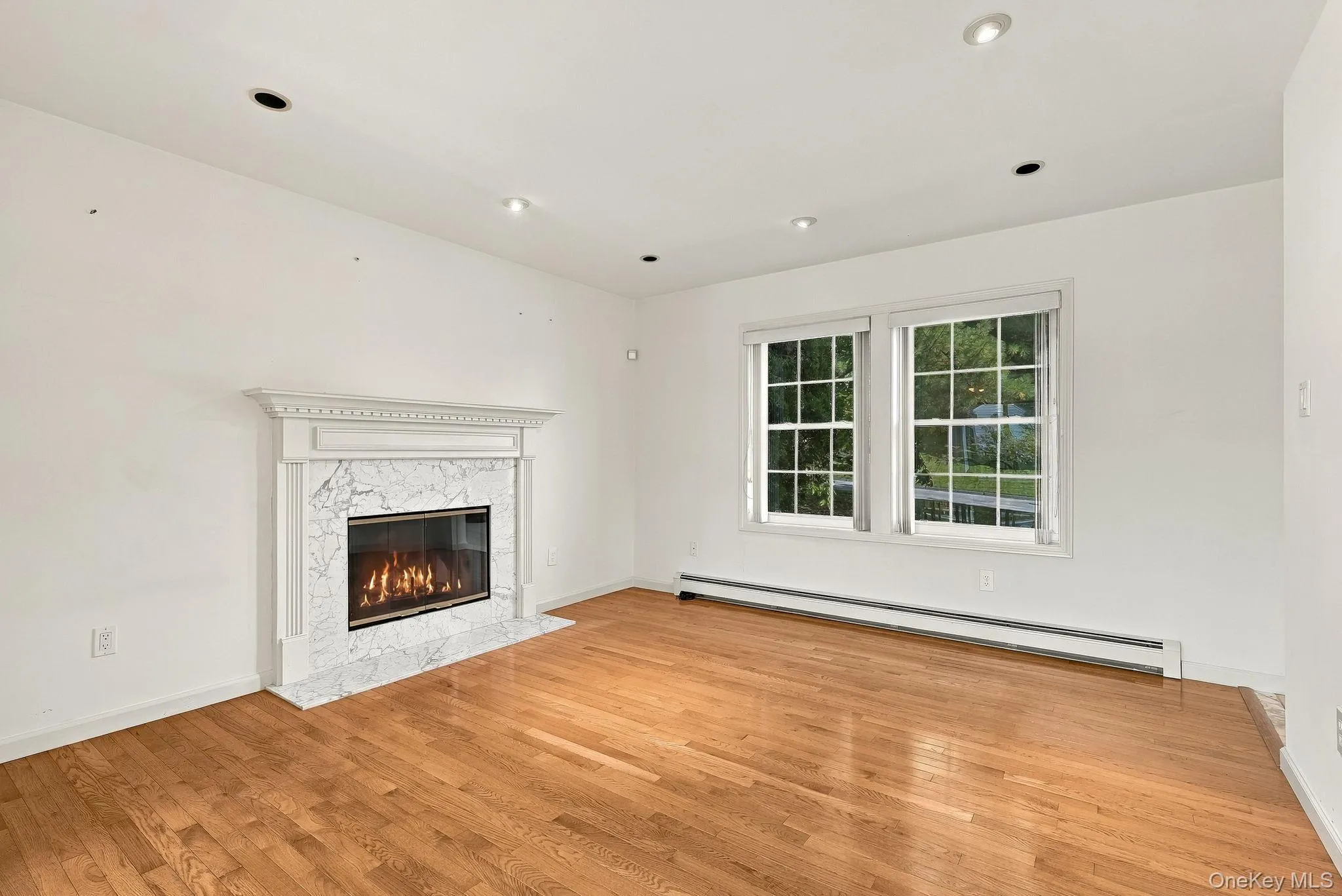 The centerpiece of the room is the hearth/mantle and a wood burning fireplace. The centerpiece of the room is the hearth/mantle and a wood burning fireplace.