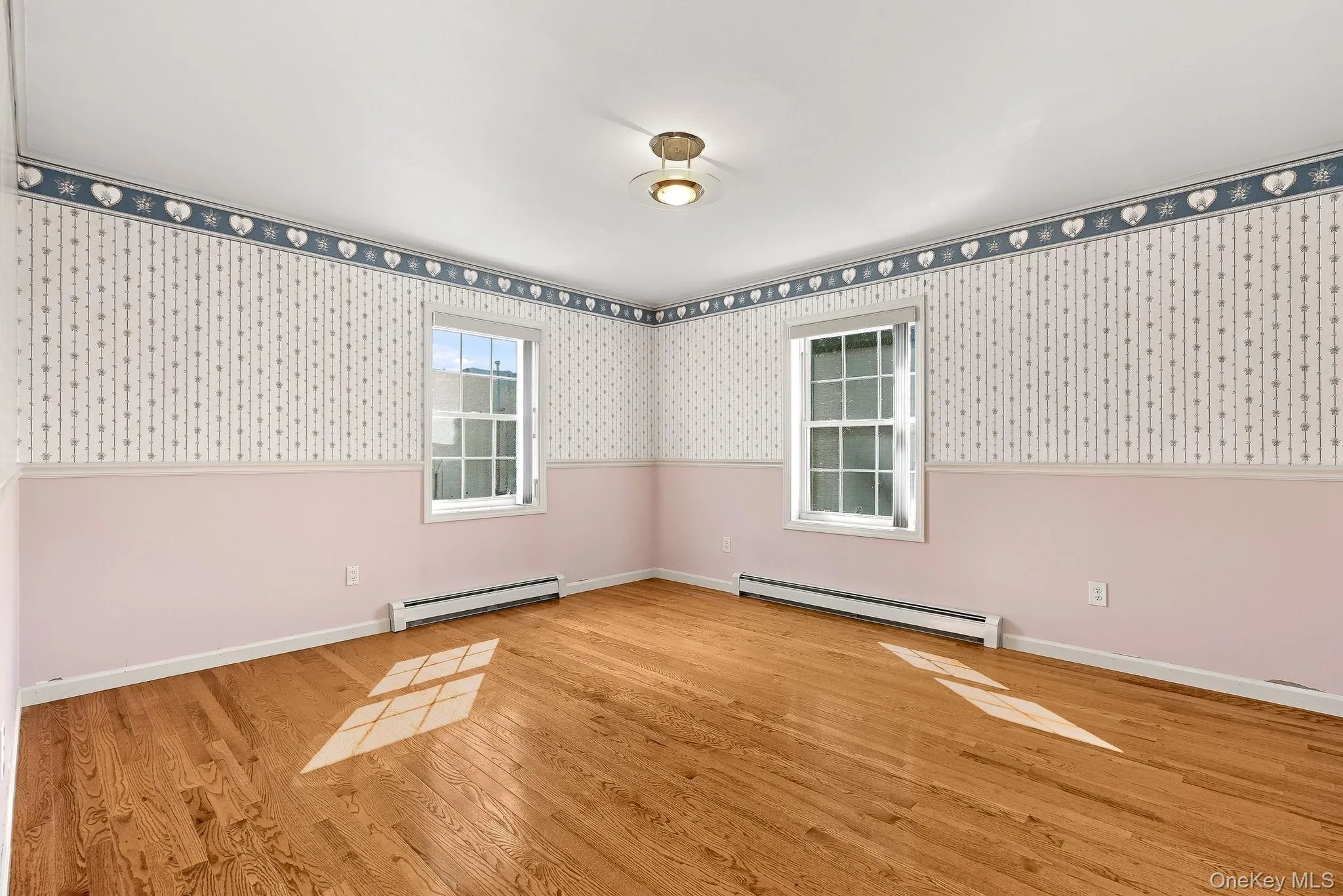 Bedroom four is at the end of the hall, to the back of the house and has windows on two sides of the space. Bedroom four is at the end of the hall, to the back of the house and has windows on two sides of the space.