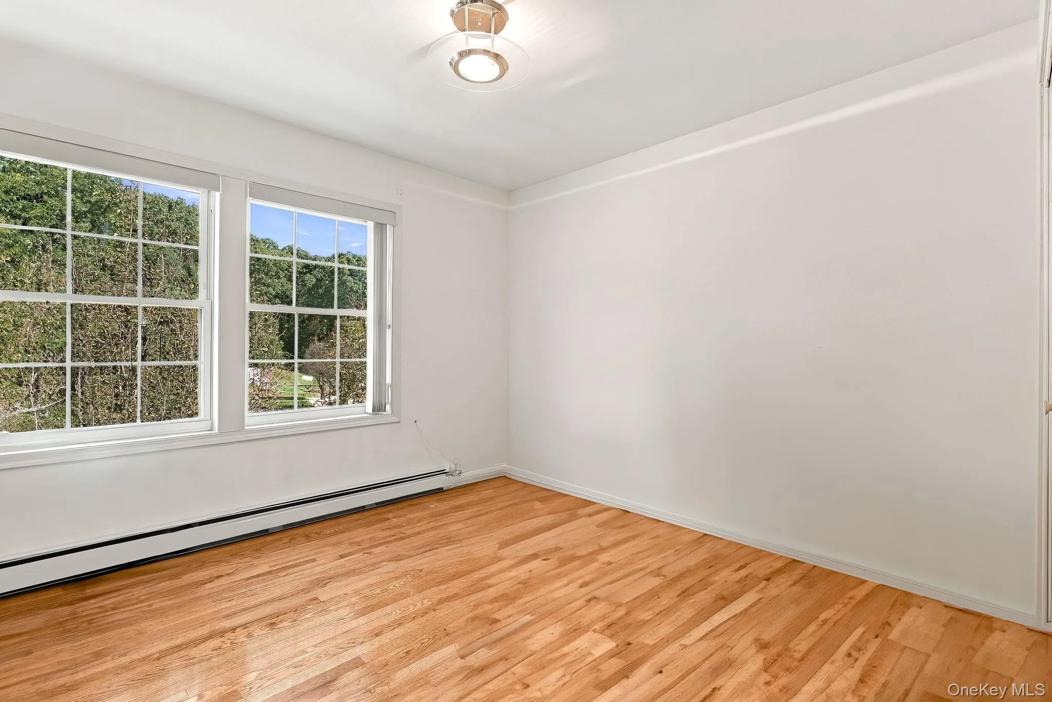 Bedroom three is at the end of the hall, front of the house. Bedroom three is at the end of the hall, front of the house.