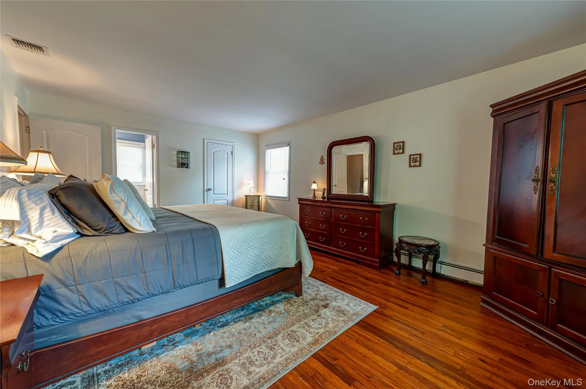 en-suite with private bathroom and hardwood floors en-suite with private bathroom and hardwood floors