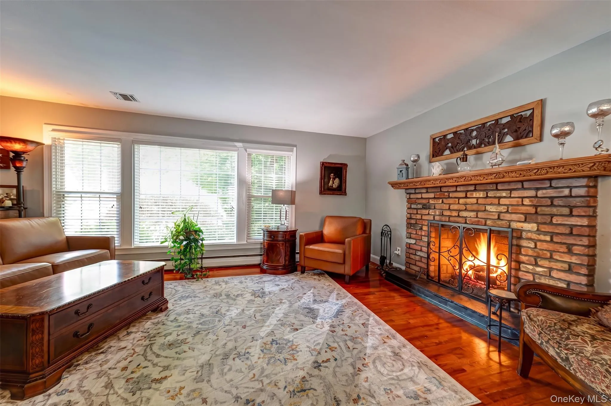 with hardwood floors and wood burning fireplace with hardwood floors and wood burning fireplace