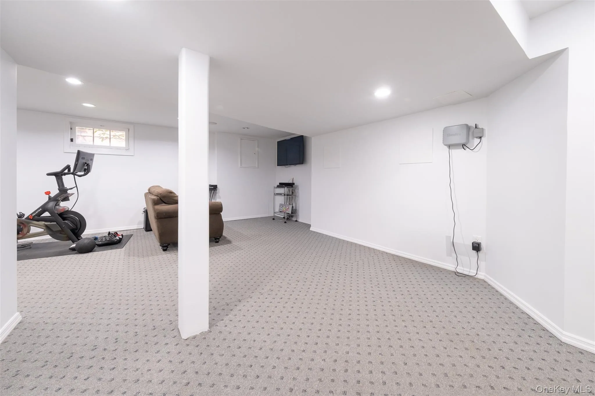 Basement featuring carpet, recessed lighting, and baseboards Basement featuring carpet, recessed lighting, and baseboards