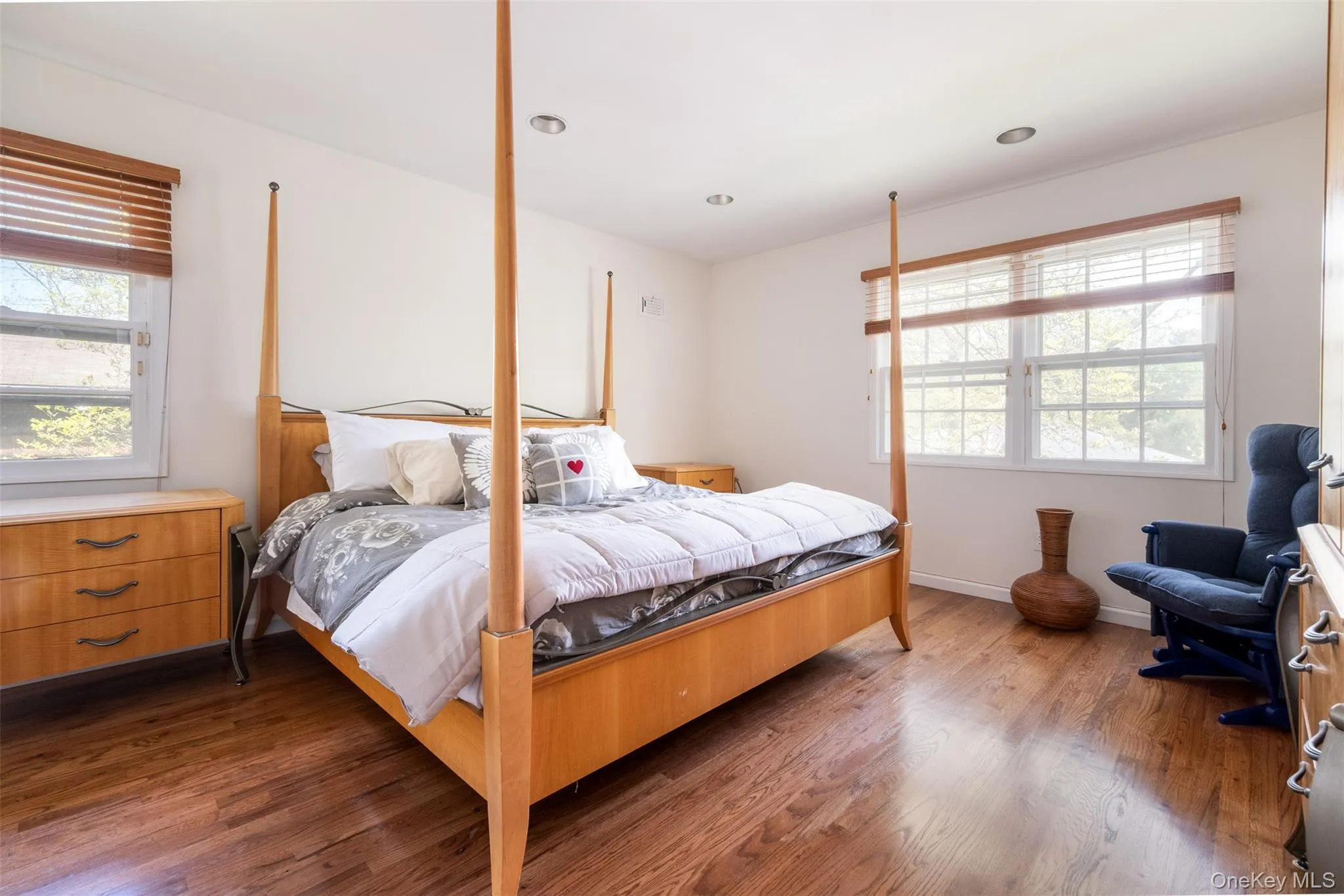 Bedroom with wood finished floors and baseboards Bedroom with wood finished floors and baseboards