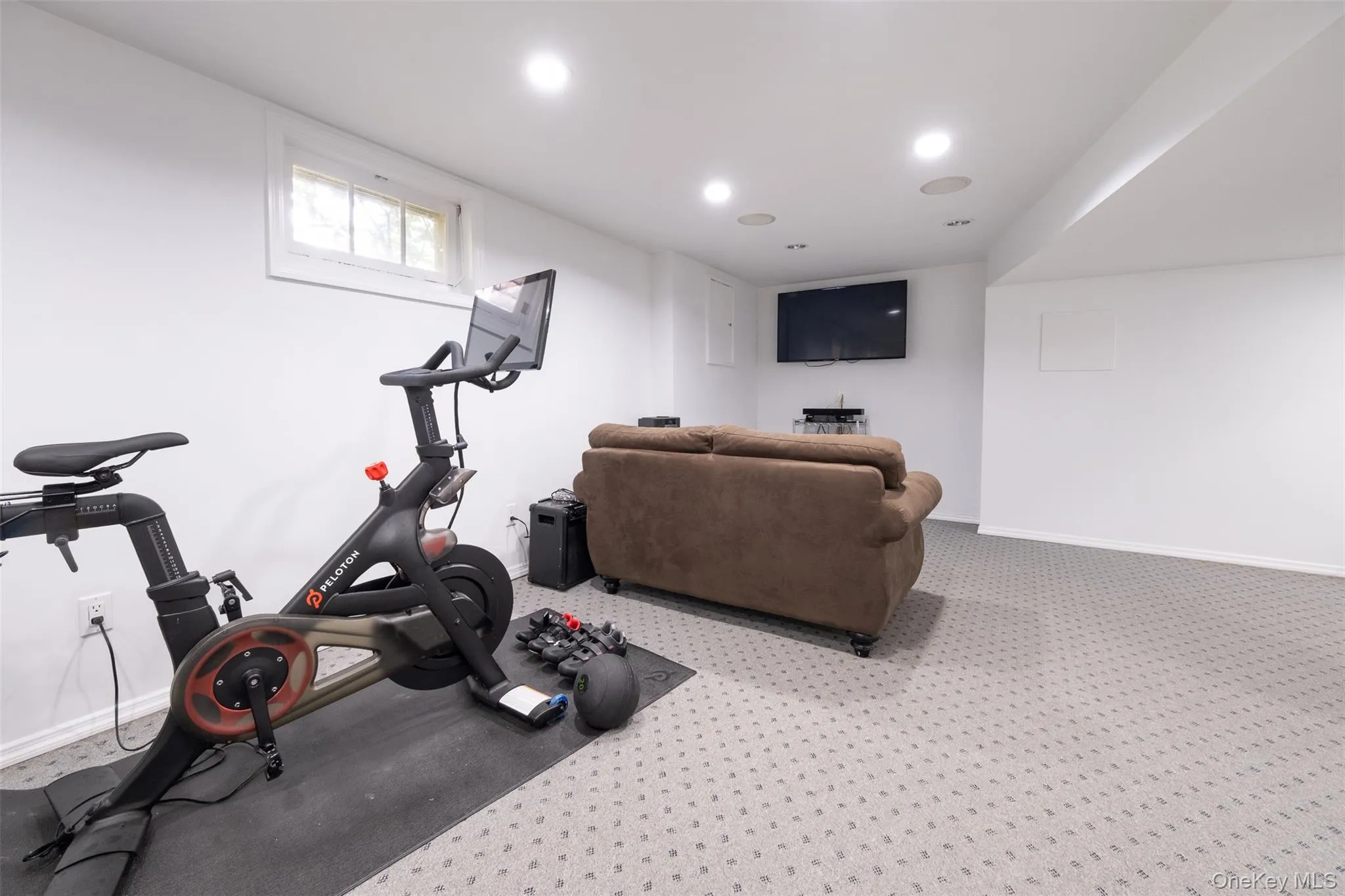 Workout room featuring baseboards, recessed lighting, and carpet Workout room featuring baseboards, recessed lighting, and carpet