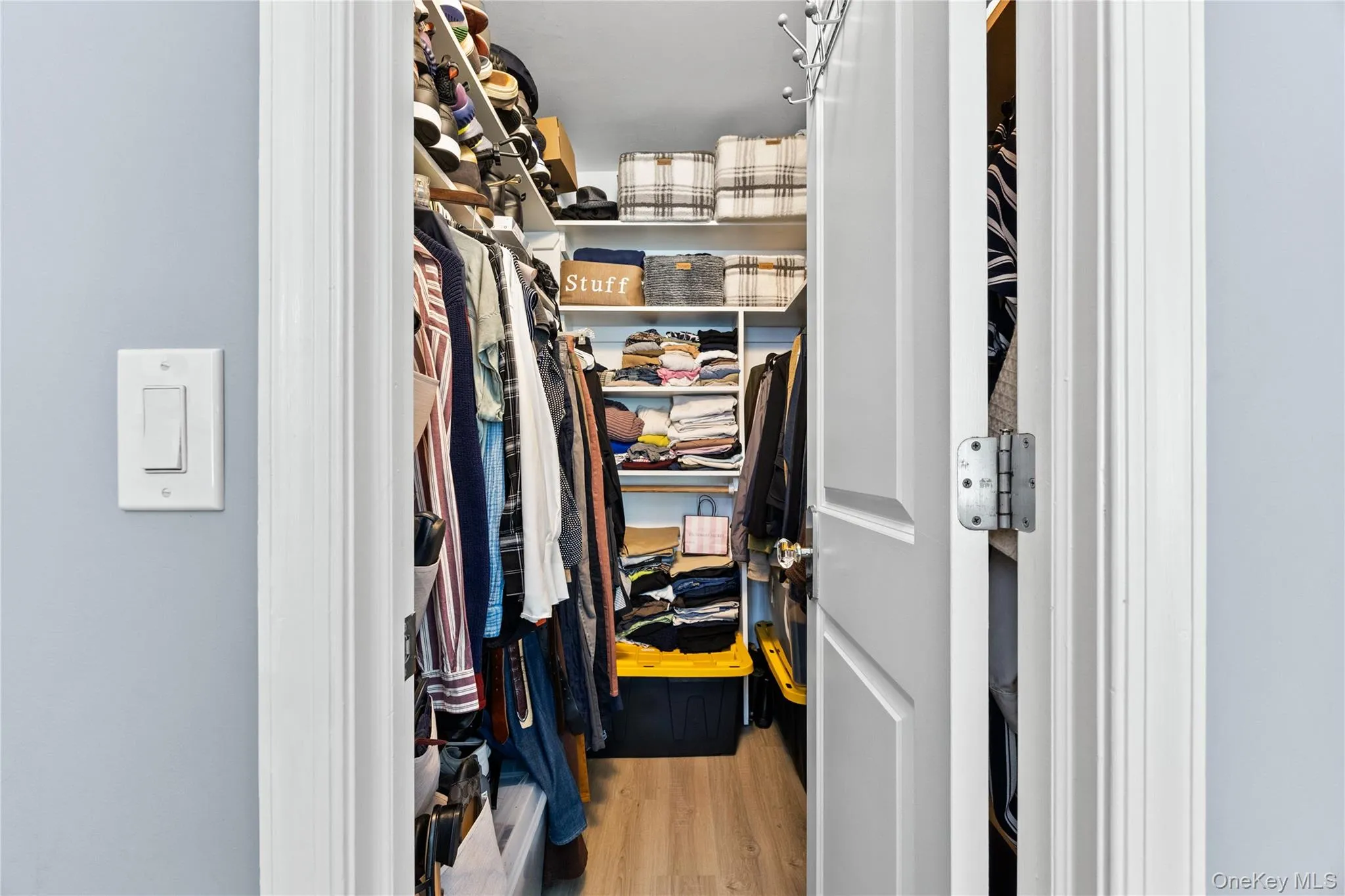 Walk-in closet in primary bedroom. Walk-in closet in primary bedroom.