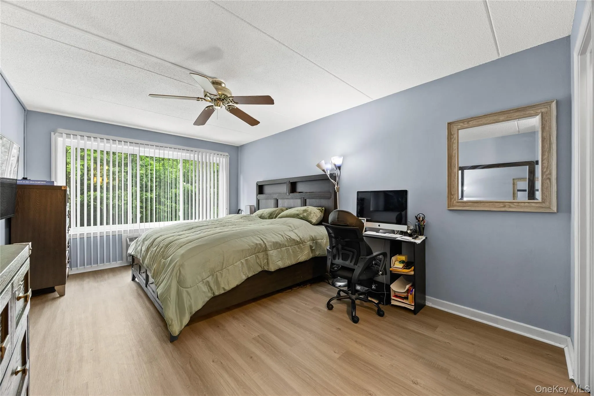 Primary bedroom with a walk-in closet and en suite bathroom. Primary bedroom with a walk-in closet and en suite bathroom.