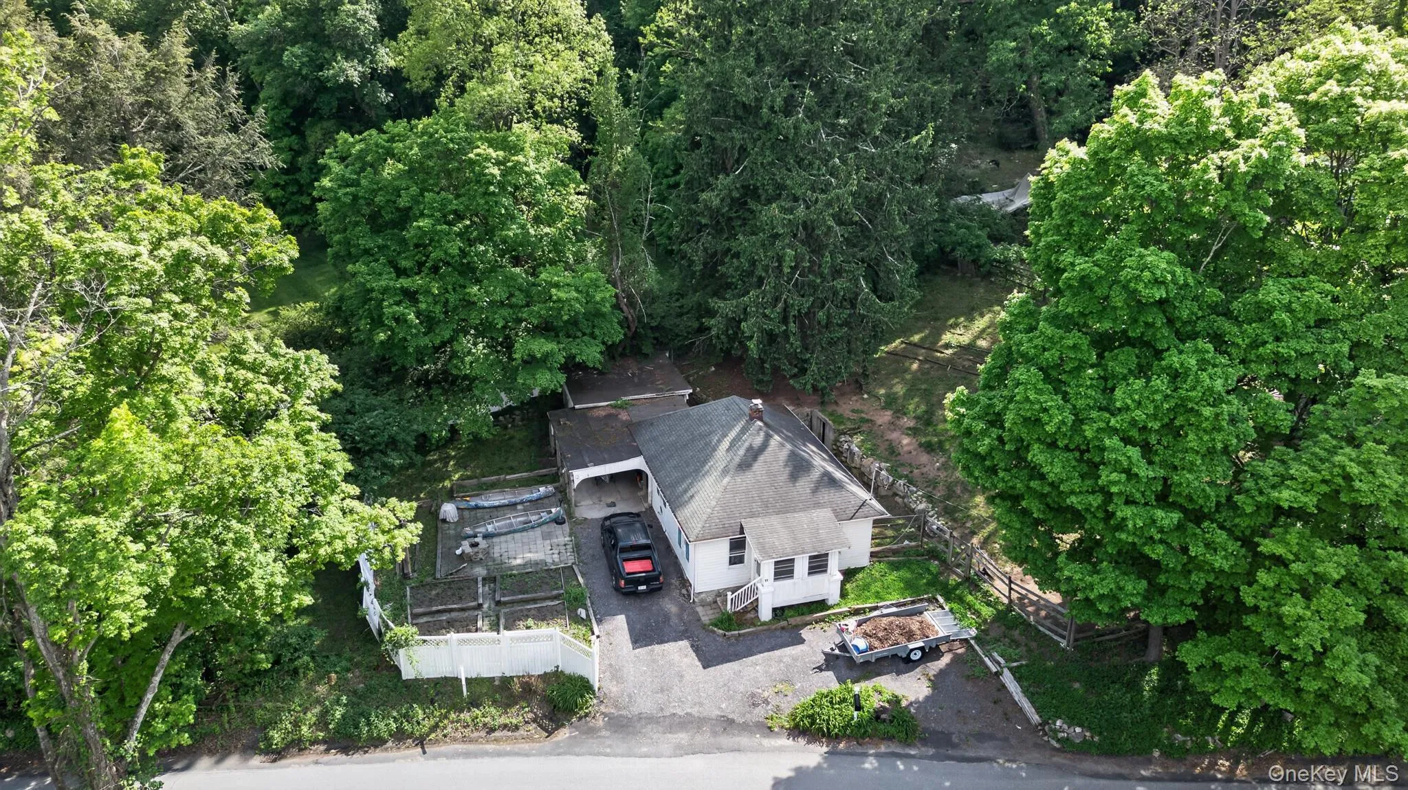 Single-story residence set amidst mature trees Single-story residence set amidst mature trees