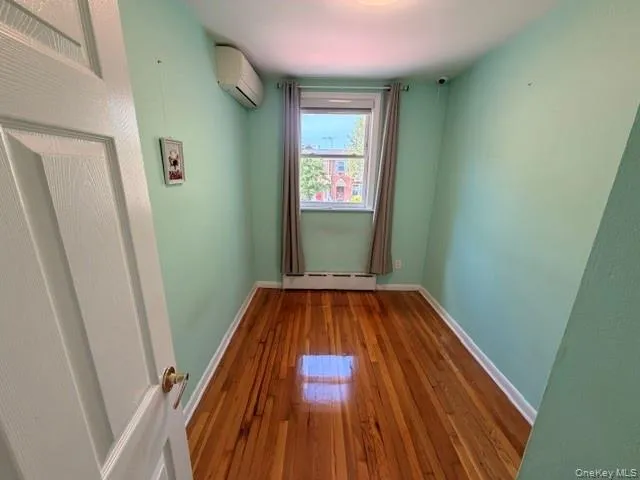 Hardwood flooring and window with natural light Hardwood flooring and window with natural light