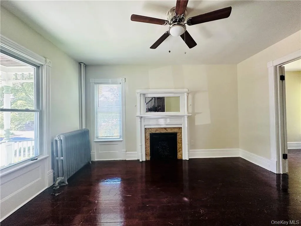 Formal Livibg Room With decorative fireplace and ceiling fan Formal Livibg Room With decorative fireplace and ceiling fan