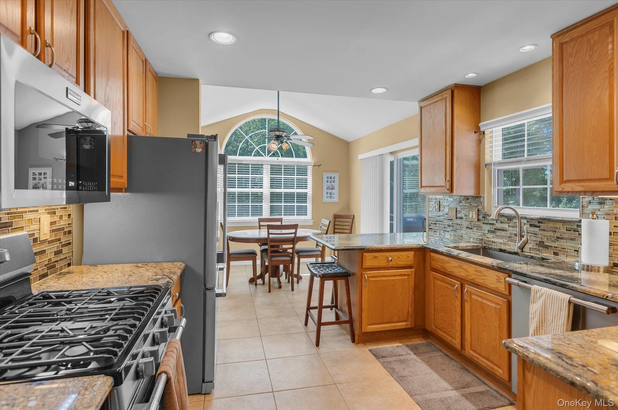 View from kitchen to dining area. View from kitchen to dining area.