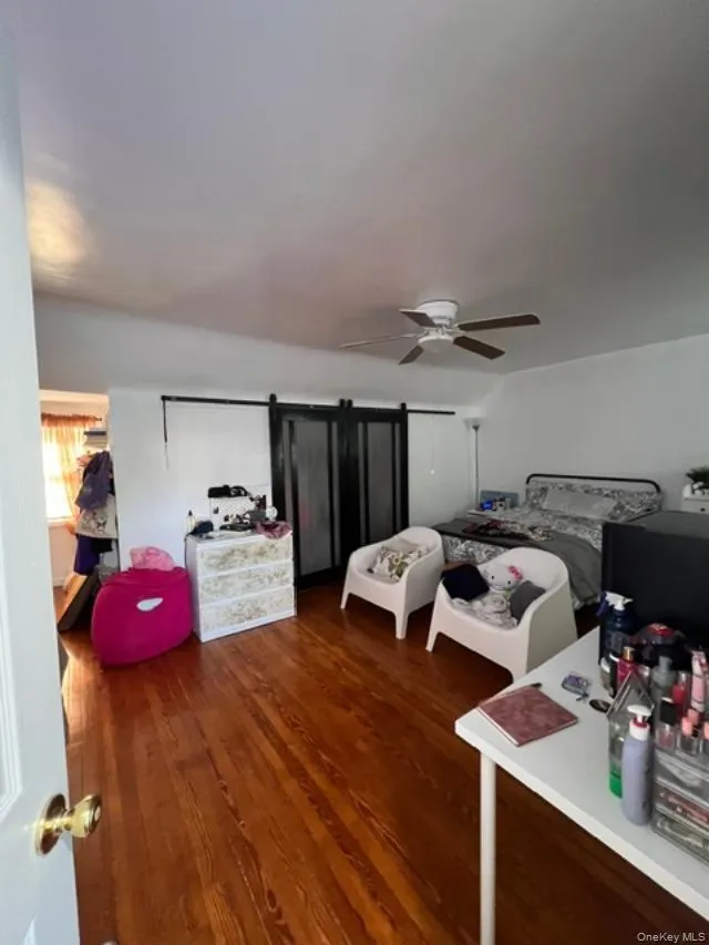 Second floor bedroom very spacious with a build in seating area, deep closets, plenty of natural light and a bathroom Hardwood flooring continues Second floor bedroom very spacious with a build in seating area, deep closets, plenty of natural light and a bathroom Hardwood flooring continues