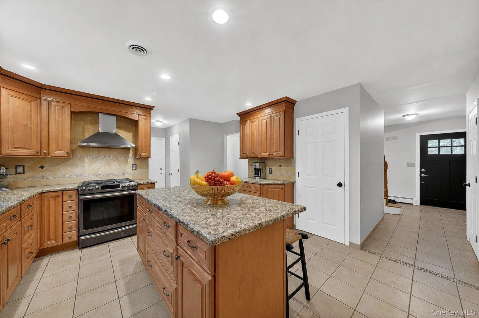 Spacious kitchen featuring ample cabinetry, generous counter space, and an ideal setup for everyday living and entertaining. Spacious kitchen featuring ample cabinetry, generous counter space, and an ideal setup for everyday living and entertaining.