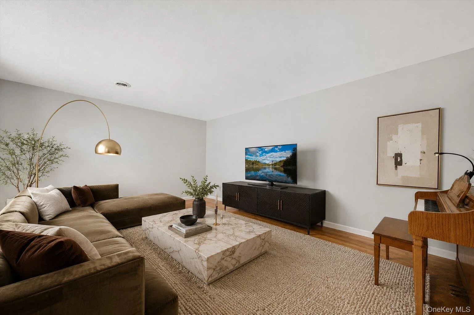 Virtually staged. Warm and welcoming family room with a comfortable setting perfect for movie nights, gatherings, or relaxing at the end of the day. Virtually staged. Warm and welcoming family room with a comfortable setting perfect for movie nights, gatherings, or relaxing at the end of the day.
