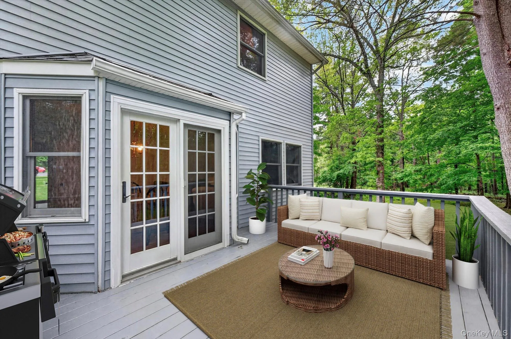 Virtually staged. Expansive deck perfect for outdoor dining, entertaining, or relaxing while overlooking the property. Virtually staged. Expansive deck perfect for outdoor dining, entertaining, or relaxing while overlooking the property.