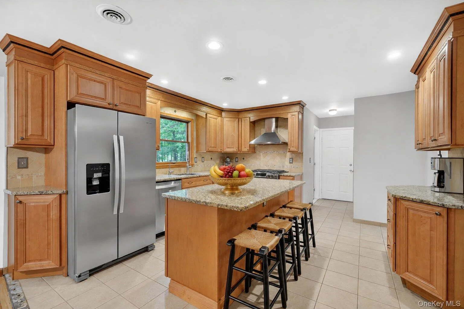 Spacious kitchen featuring ample cabinetry, generous counter space, and an ideal setup for everyday living and entertaining. Spacious kitchen featuring ample cabinetry, generous counter space, and an ideal setup for everyday living and entertaining.