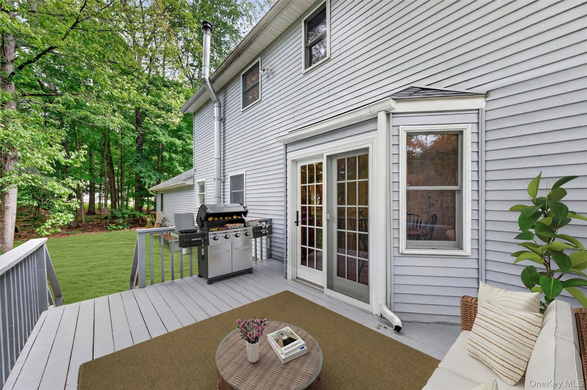 Virtually staged. Expansive deck perfect for outdoor dining, entertaining, or relaxing while overlooking the property. Virtually staged. Expansive deck perfect for outdoor dining, entertaining, or relaxing while overlooking the property.