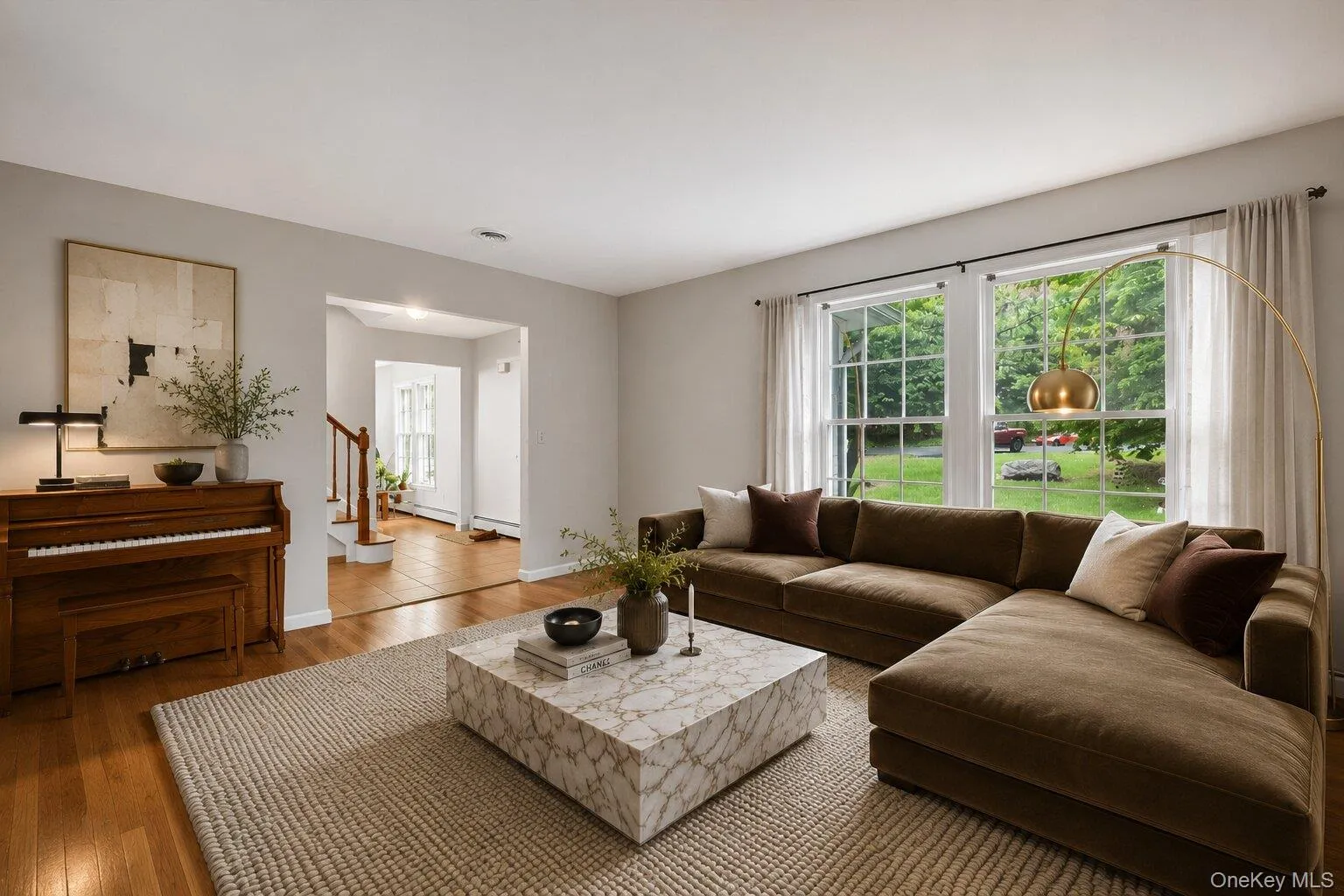 Virtually staged. Warm and welcoming family room with a comfortable setting perfect for movie nights, gatherings, or relaxing at the end of the day. Virtually staged. Warm and welcoming family room with a comfortable setting perfect for movie nights, gatherings, or relaxing at the end of the day.