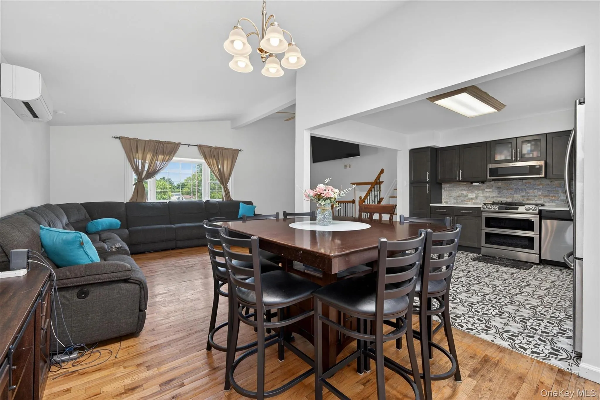 Living and dining area with hardwood flooring. Living and dining area with hardwood flooring.