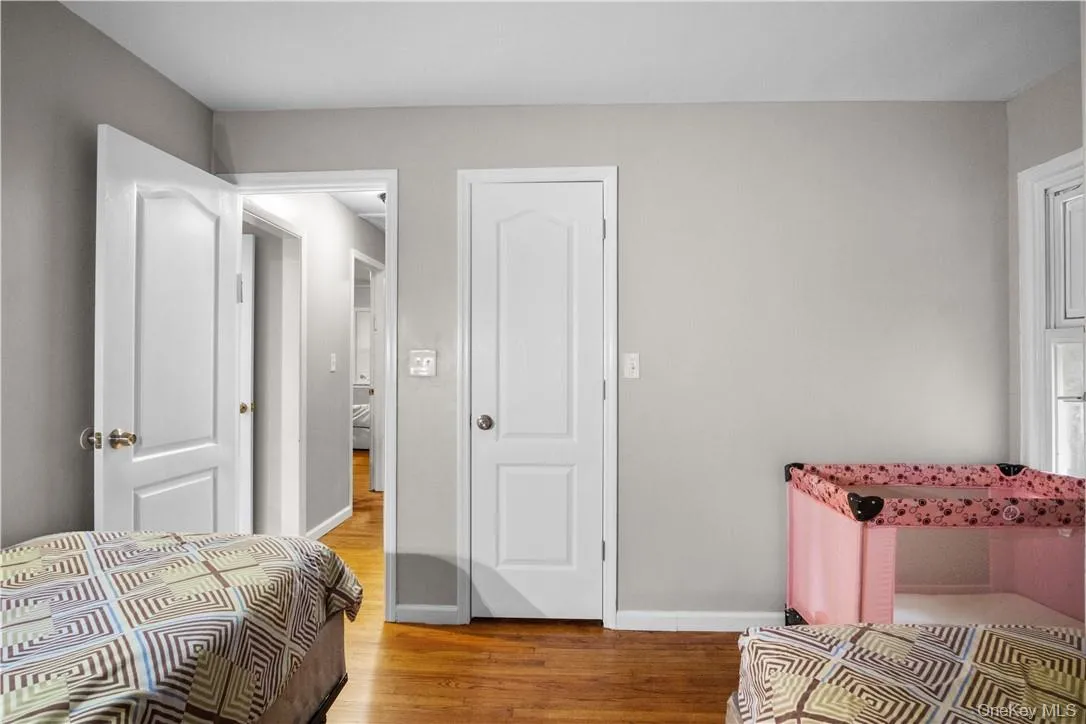Bedroom with light hardwood / wood-style flooring Bedroom with light hardwood / wood-style flooring