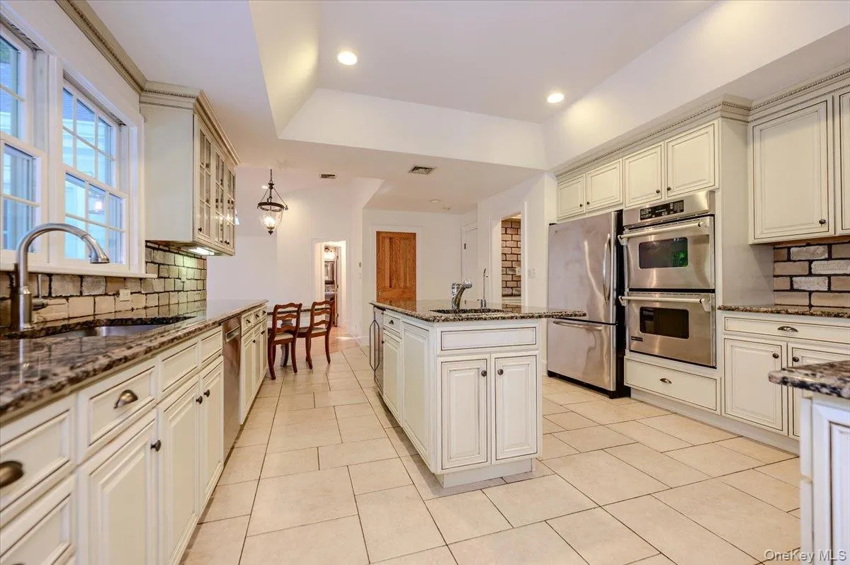 Scaled to perfection w/tile floors, inset ceiling and Cambridge cabinets Scaled to perfection w/tile floors, inset ceiling and Cambridge cabinets