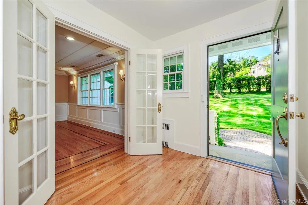 Foyer w/wood floors ~ opens to dining room, living room and coat closet Foyer w/wood floors ~ opens to dining room, living room and coat closet